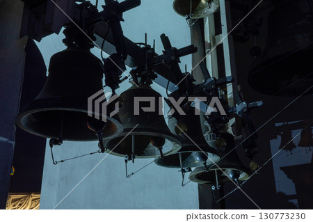 Huge bells inside of the bell tower of St. Michael's Golden-Domed Monastery at night. Orthodox Easter bells ringing. Kyiv, Ukraine. Huge bells inside of the bell tower of St. Michael's Golden-Domed Monastery at night. Orthodox Easter bells ringing. Kyiv, Ukraine. 130773230