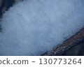 Snow on a branch close-up in winter at night 130773264