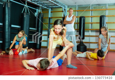 Children self defense training in gym Children self defense training in gym 130773410