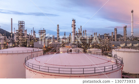 Aerial view oil and gas refinery plant at night, Global business energy logistic transportation, Oil and gas refinery petrochemical industrial, Petrochemical refinery industrial energy supply chain. 130773933