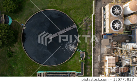 Aerial view wastewater treatment plant, Sustainable water management environment, Black water treatment tank with waste water, Circle circular water clarifier cleaning water. Aerial view wastewater treatment plant, Sustainable water management environment, Black water treatment tank with waste water, Circle circular water clarifier cleaning water. 130773937