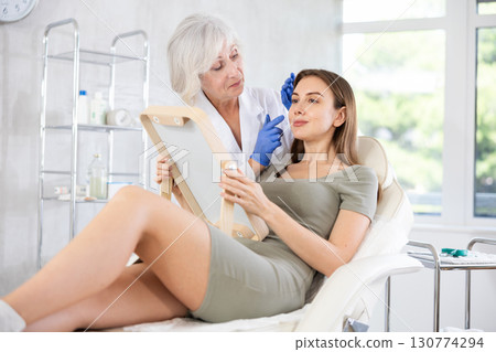 Young patient with mirror 130774294