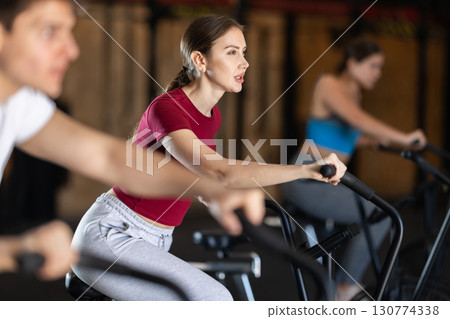 Woman training on an airbike 130774338