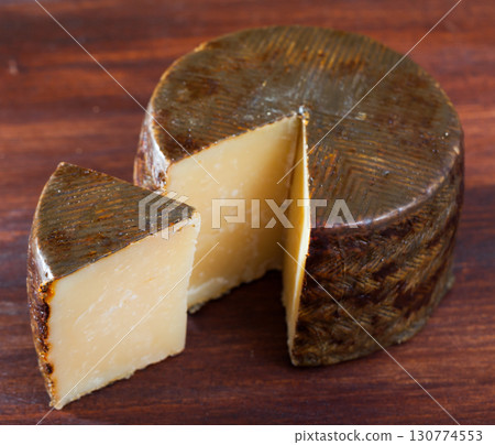 Spanish Manchego cheese 130774553