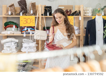 Woman buying bag on sale 130774592