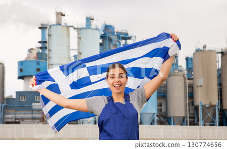 Cheerful young woman demonstrates the national flag of Greece 130774656
