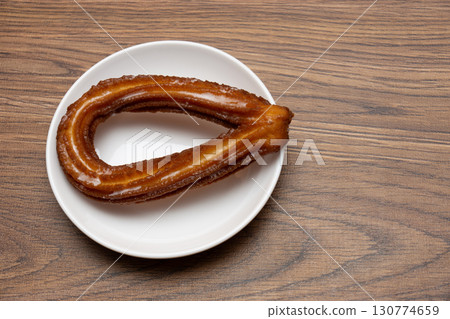 White plate and churros 130774659