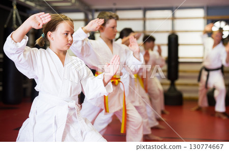 Young boys and girls in kimono doing kata 130774667