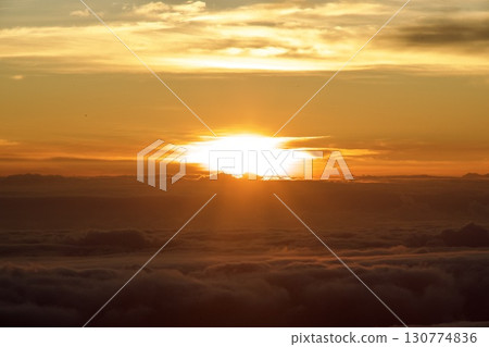 The glow of the morning sun seen from Mauna Kea on the Big Island of Hawaii 130774836