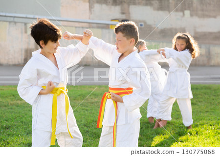Kids sparring during karate training 130775068