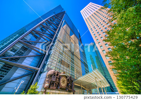 Tokyo cityscape in Japan: A view of the NTV Big Clock, a symbol of Shiodome that is popular with foreign tourists 130775429