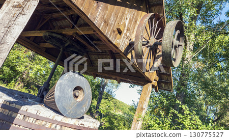 Antique shredder, branch crusher under a wooden roof in Slovakia. In working condition. 130775527
