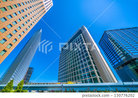 Tokyo cityscape in Japan, including contrails, the Shiodome business district, and the Yurikamome train line (15th) 130776202