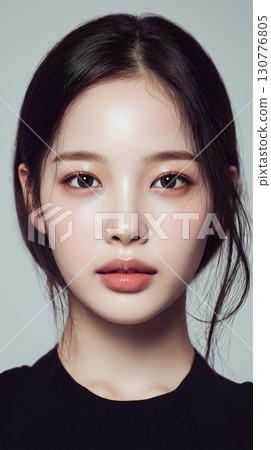 Korean woman with natural beauty posing in a minimalistic studio setting during a photoshoot 130776805