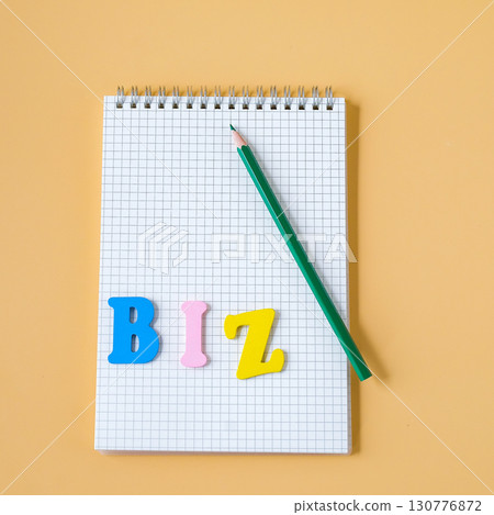 Booknote with color pencil and text on color background. Booknote with color pencil and text on color background. 130776872