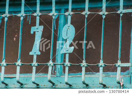 Blue Iron Window with Number 72 at Xian Guang Military Kindred Village. Blue Iron Window with Number 72 at Xian Guang Military Kindred Village. 130780414