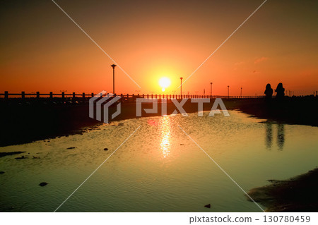 Stunning Winter Sunset Reflection at Yong-an Fishing Harbor Taiwan. Stunning Winter Sunset Reflection at Yong-an Fishing Harbor Taiwan. 130780459
