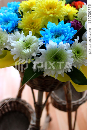 Rattan Rack With Bouquet Of Fresh Flowers In Wrapped Paper In A Flowers Store Stock Photo For Vertical Story 130780776