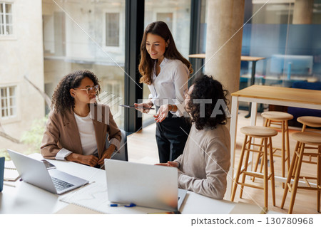 Teamwork in the Contemporary Office Space Collaborative Meeting Sessions Ideas Sharing 130780968