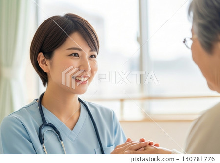 Smiling medical professionals and the warmth of elderly people's hands 130781776