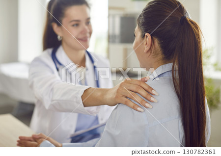 Doctor Or Nurse Supporting Patient During Hospital Consultation Doctor Or Nurse Supporting Patient During Hospital Consultation 130782361