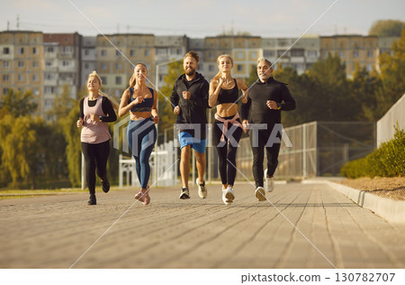 Jogging Group Training Session In City Park 130782707