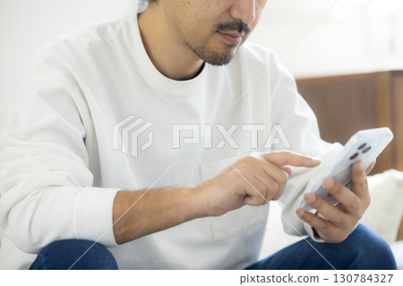 man in living room 130784327