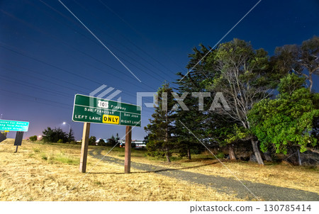 A U.S. Route 101 freeway sign near San Francisco International Airport (SFO) in California, USA. The illuminated sign gives directions to San Francisco and San Jose 130785414