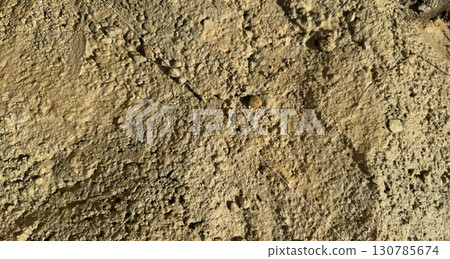 Dry cracked soil texture symbolizing drought and climate change 130785674