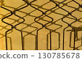 Abstract metal shadow pattern on yellow wall 130785678