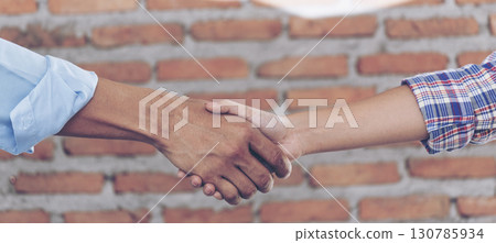 Banner Trust honesty business customer handshake together promise partner. Panorama Businessman teamwork diversity solidarity team Partner hands together. Team meeting shaking hands with copy space 130785934