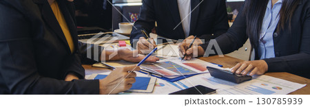 Banner Group of business people meeting in conference room. Panorama Asian businesspeople brainstorm teamwork partnership. Happy teams meeting graph chart business data meeting room with copy space 130785939