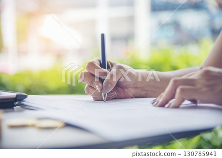 Banner Businesswoman hands note meeting document conference room. Woman Hands writing planning on notebook. Banner Female hand holding pen write on diary sketchbook. Business signing with copy space 130785941