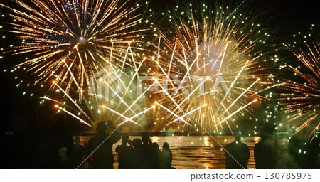 Colorful vibrant Firework celebrate anniversary happy new year 2024, 4th of july holiday festival. colorful firework in night time to celebrate national holiday. countdown new year party background 130785975