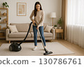 Woman cleaning in the living room 0037 130786761