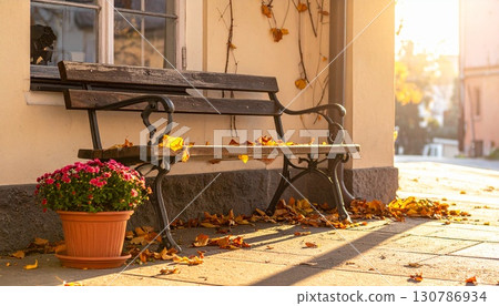 A cute cafe entrance with a bench A cute cafe entrance with a bench 130786934