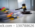 Business law concept with judge gavel and stacked documents on office desk, symbolizing corporate legal advice, compliance, contract regulation, and professional justice system. 130788626