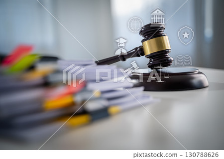 Business law concept with judge gavel and stacked documents on office desk, symbolizing corporate legal advice, compliance, contract regulation, and professional justice system. 130788626