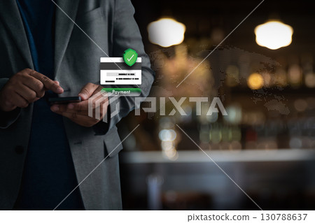 Businessman using smartphone for secure online payment, credit card verification, and mobile banking. Cybersecurity, encryption, and global ecommerce checkout concept with bokeh city cafe background. Businessman using smartphone for secure online payment, credit card verification, and mobile banking. Cybersecurity, encryption, and global ecommerce checkout concept with bokeh city cafe background. 130788637