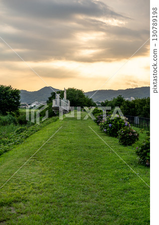 A walking path dyed in the sunset 130789198