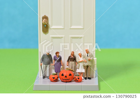 Halloween commemorative photo of residents and ghost pumpkins at a nursing home 130790025