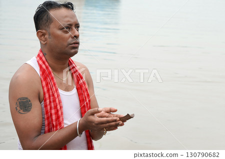 Sacred tarpan ceremony at Ganga river in Kolkata Sacred tarpan ceremony at Ganga river in Kolkata 130790682