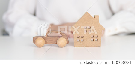 house and Car model on table. real estate, Home mortgage and car loan, tax, investment, financial, savings, interest rate, economic recession house and Car model on table. real estate, Home mortgage and car loan, tax, investment, financial, savings, interest rate, economic recession 130790781