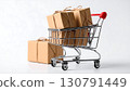 Small shopping cart with brown parcel packages and ribbon 130791449
