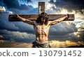 Crucified man with crown of thorns on cross at sunset, solemn mood 130791452