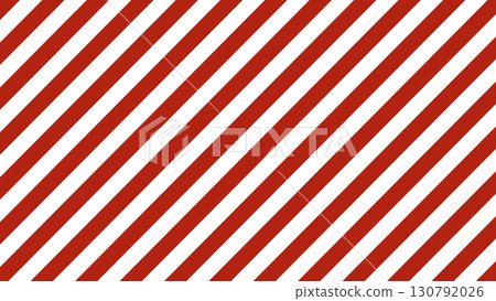 Red and white diagonal striped background. Candy cane inspired design with festive holiday mood. Bright abstract texture with attention signal style for Christmas, decor, and creative projects. 130792026