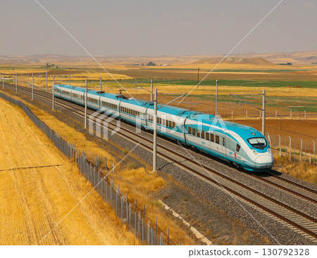 Turkish high-speed train running on tracks Turkish high-speed train running on tracks 130792328
