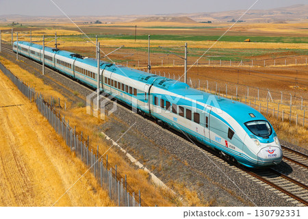 Turkish high-speed trains speeding along the tracks 130792331