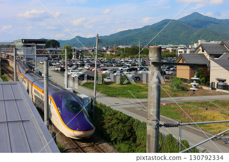 Yamagata Shinkansen Tsubasa E8 series train entering the station Yamagata Shinkansen Tsubasa E8 series train entering the station 130792334