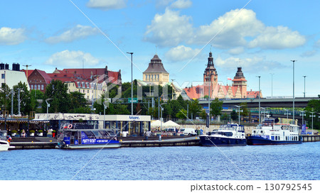 Szczecin, Poland. 16 July 2025. Landscape view and ships and boats on the Odra River Szczecin, Poland. 16 July 2025. Landscape view and ships and boats on the Odra River 130792545